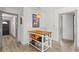 Bright kitchen features a moveable island and doorway views to the home's entry and another room at 914 Woodland Dr, Palm Harbor, FL 34683
