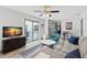 The living room features backyard access with views of the kitchen, making it a perfect entertainment space at 914 Woodland Dr, Palm Harbor, FL 34683
