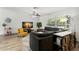 Bright and inviting living room featuring a large sectional sofa and modern decor at 914 Woodland Dr, Palm Harbor, FL 34683