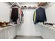 Well-organized walk-in closet with shelving for shoes, hats, and hanging space for clothing at 914 Woodland Dr, Palm Harbor, FL 34683