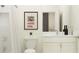 Bright bathroom featuring a shower with white tile and marble countertops at 9384 Gladsome Dr, Land O Lakes, FL 34637