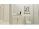 Clean white bathroom with walk-in shower and stylish vanity at 9384 Gladsome Dr, Land O Lakes, FL 34637