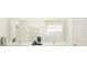 Bathroom featuring double sinks, a large mirror, and modern fixtures at 9384 Gladsome Dr, Land O Lakes, FL 34637