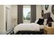 Stylish bedroom featuring musical accents and natural lighting at 9384 Gladsome Dr, Land O Lakes, FL 34637