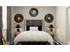 Well-decorated bedroom showcasing musical taste with record art and a guitar at 9384 Gladsome Dr, Land O Lakes, FL 34637