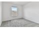 Cozy bedroom featuring a window and neutral carpet at 9766 Crescent Moon Dr, Riverview, FL 33578