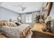 Calming bedroom with ceiling fan, neutral tones, and large decorative mirror at 10115 Kenlake Dr, Riverview, FL 33578