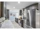 Well-equipped kitchen with stainless steel appliances and an adjacent dining area at 10115 Kenlake Dr, Riverview, FL 33578