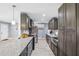 Spacious kitchen with a large island, modern cabinets, and tiled floors at 10115 Kenlake Dr, Riverview, FL 33578