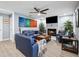 Comfortable living room featuring a fireplace, hardwood floors, and ample seating at 10115 Kenlake Dr, Riverview, FL 33578