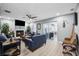 Cozy living room with fireplace, modern furniture, and a view of the backyard at 10115 Kenlake Dr, Riverview, FL 33578