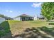 Expansive backyard featuring a manicured lawn and a privacy fence at 10463 Baylor Dr, Spring Hill, FL 34608