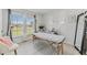 Bright room features a window view and a massage table at 10463 Baylor Dr, Spring Hill, FL 34608