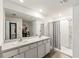 Bright bathroom featuring double sinks and a stand-up shower at 10463 Baylor Dr, Spring Hill, FL 34608