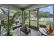 Relaxing screened porch with comfortable seating and views of the lush backyard at 10463 Baylor Dr, Spring Hill, FL 34608