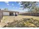 Spacious backyard with patio, grill, table, and a privacy fence at 1309 Malone Ave, Spring Hill, FL 34606