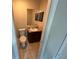 Bathroom featuring a vanity with a marble countertop and storage at 1309 Malone Ave, Spring Hill, FL 34606