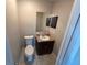 Bathroom featuring a vanity with a marble countertop and storage at 1309 Malone Ave, Spring Hill, FL 34606
