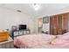 Cozy bedroom featuring a comfortable bed, mounted tv, storage and closet space at 1309 Malone Ave, Spring Hill, FL 34606
