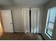 Bedroom featuring light wall-to-wall carpet and a window at 1309 Malone Ave, Spring Hill, FL 34606