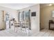 Bright dining room with a white table and matching chairs at 1309 Malone Ave, Spring Hill, FL 34606