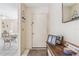 Entryway with a welcome sign, a table with photos and a dining room in the background at 1309 Malone Ave, Spring Hill, FL 34606