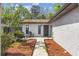 Walkway leading to the front door and chairs at 1309 Malone Ave, Spring Hill, FL 34606