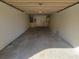 An empty garage with white walls and a concrete floor at 1309 Malone Ave, Spring Hill, FL 34606