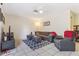 Inviting living room with neutral walls, gray sectional and tile flooring at 1309 Malone Ave, Spring Hill, FL 34606