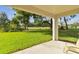 Covered patio overlooking a manicured backyard at 1341 Marinella Dr, Palm Harbor, FL 34683