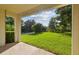The covered patio offers panoramic backyard views and a tranquil spot to relax at 1341 Marinella Dr, Palm Harbor, FL 34683