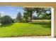 The covered patio offers panoramic backyard views and a tranquil spot to relax at 1341 Marinella Dr, Palm Harbor, FL 34683