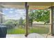 This balcony has a great view of the golf course and lush green trees at 1341 Marinella Dr, Palm Harbor, FL 34683