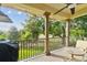 Relax on the covered balcony with its scenic golf course and lush tree views at 1341 Marinella Dr, Palm Harbor, FL 34683