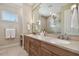 Bathroom boasts double sinks, a large mirror, and well-lit vanity for convenience at 1341 Marinella Dr, Palm Harbor, FL 34683