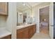 Bathroom featuring double sinks and vanity with access to the spacious bedroom at 1341 Marinella Dr, Palm Harbor, FL 34683