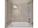 Bathroom with tiled walls and frameless glass shower doors at 1341 Marinella Dr, Palm Harbor, FL 34683