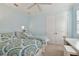 Bedroom featuring two beds, ceiling fan and white trim at 1341 Marinella Dr, Palm Harbor, FL 34683