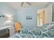 Bedroom featuring two beds, ceiling fan, white trim and desk with chair at 1341 Marinella Dr, Palm Harbor, FL 34683