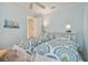 Bedroom featuring two beds, ceiling fan and white trim at 1341 Marinella Dr, Palm Harbor, FL 34683