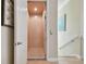 Open home elevator with wood interior, located adjacent to the staircase at 1341 Marinella Dr, Palm Harbor, FL 34683