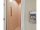 An in-home elevator features a digital call panel and buttons for convenient access between floors at 1341 Marinella Dr, Palm Harbor, FL 34683