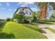 A well-maintained lawn surrounds this charming two-story residence at 1341 Marinella Dr, Palm Harbor, FL 34683