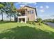 The beautiful two-story home features a stone facade and a manicured lawn at 1341 Marinella Dr, Palm Harbor, FL 34683