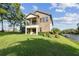 The beautiful two-story home features a stone facade and a manicured lawn at 1341 Marinella Dr, Palm Harbor, FL 34683