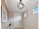 Bright foyer showcases hardwood floors and decorative art, creating a welcoming entrance at 1341 Marinella Dr, Palm Harbor, FL 34683