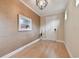 Bright foyer showcases hardwood floors and decorative art, creating a welcoming entrance at 1341 Marinella Dr, Palm Harbor, FL 34683