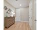 Attractive hallway featuring hardwood floors, decorative furniture, and multiple entryways at 1341 Marinella Dr, Palm Harbor, FL 34683