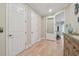Spacious hallway offers hardwood floors and convenient access to multiple rooms at 1341 Marinella Dr, Palm Harbor, FL 34683