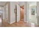 Hallway featuring an open residential elevator, wood floors and neutral wall paint at 1341 Marinella Dr, Palm Harbor, FL 34683